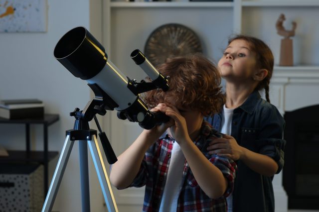 Cute,Little,Children,Using,Telescope,To,Look,At,Stars,In